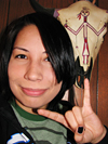 Not actually a "Rock On" symbol--I'm just doing on impersonation of the skull behind me.