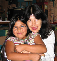 Joy Harjo and granddaughter in the midst of a highly competitive cuteness competition. They beat many other contestants, such as Sleeping-Pile-of-Puppies and Baby-in-Daddys-Baseball-Cap. Unfortunately, that kid from Jerry Maguire showed up, miraculously unaged, and started swinging on the judges' arms. Better luck next year, ladies!