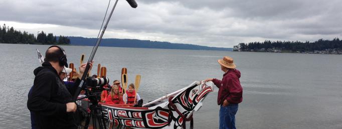 The Growing Native crew films as Tulalip Tribal Chairman Melvin R. Sheldon, Jr. grants the canoes participating in the 24th Annual Canoe Journey permission to leave. Photo by Shirley K. Sneve (Rosebud Sioux) & Vision Maker Media. 