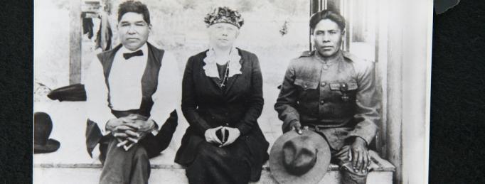 Picture of the Oklahombi family. Joseph, in his Army uniform, sits on his front porch with his parents. Photo by National Archives. 